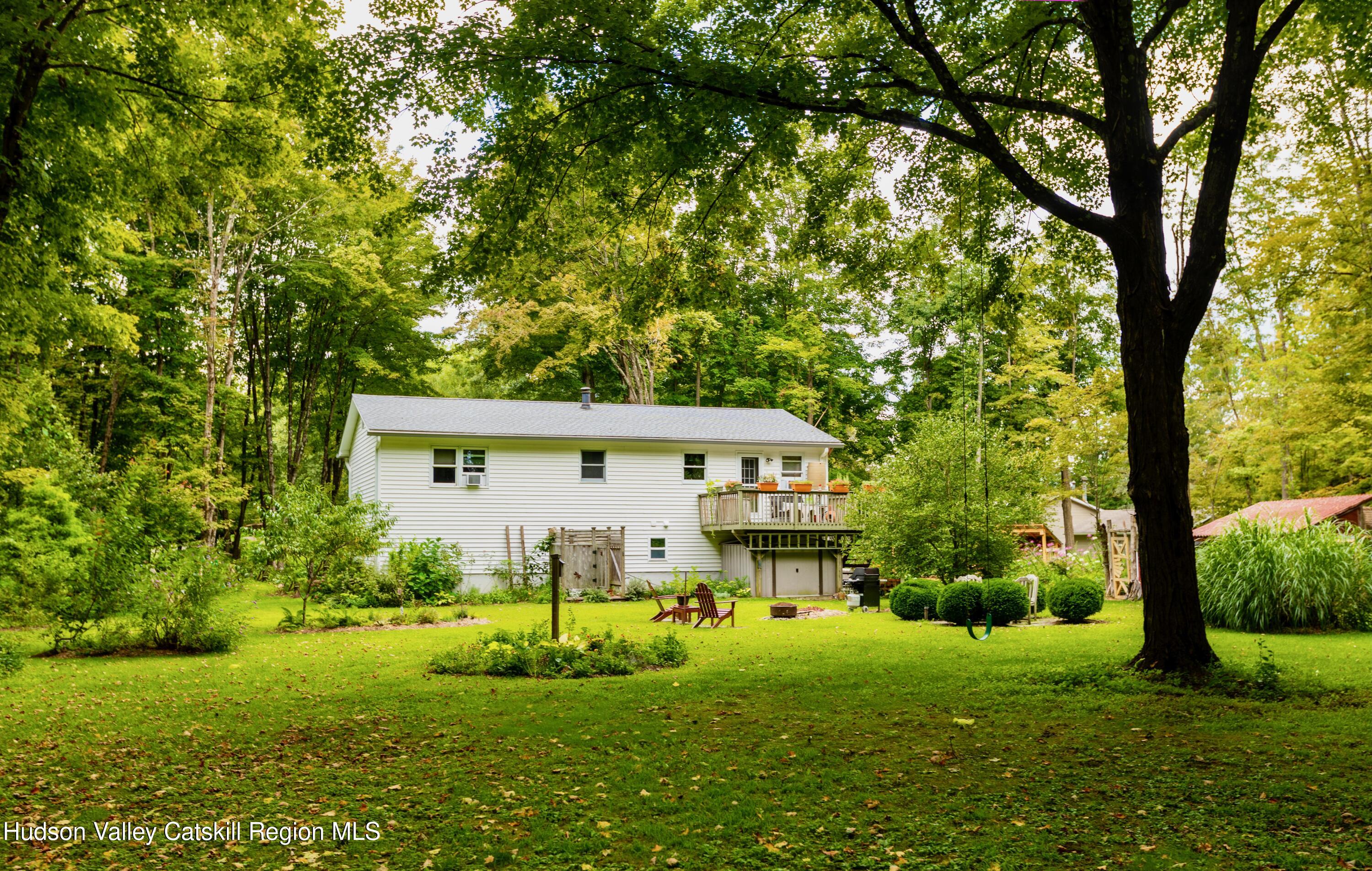 424 Tongore Way Kingston, NY 12401 - Photo 32 of 40 a view of a house with backyard and garden