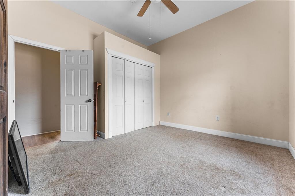4400 Nye Road West Springfield, PA 16443 - Photo 23 of 31 an empty room with chandelier fan