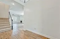 a view of a hallway with stairs