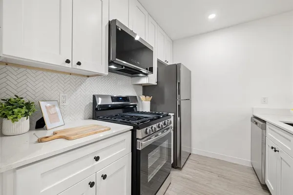 a kitchen with a stove and a microwave