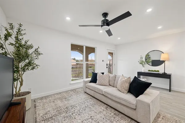 a living room with furniture and window