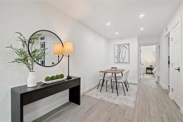 a view of dining room filled with furniture and wooden floor