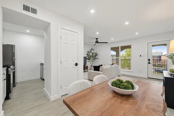 a kitchen with stainless steel appliances a stove microwave and refrigerator
