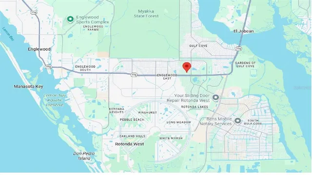 a bathroom with a bathtub and mirror