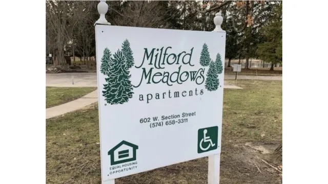 a sign broad on wooden floor