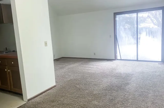 an empty room with a large window