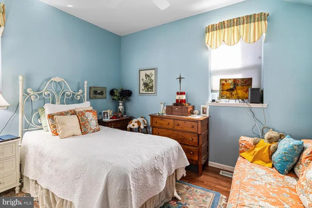 a bed room with a bed and a dresser