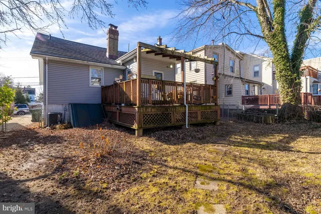 a view of a backyard with sitting area