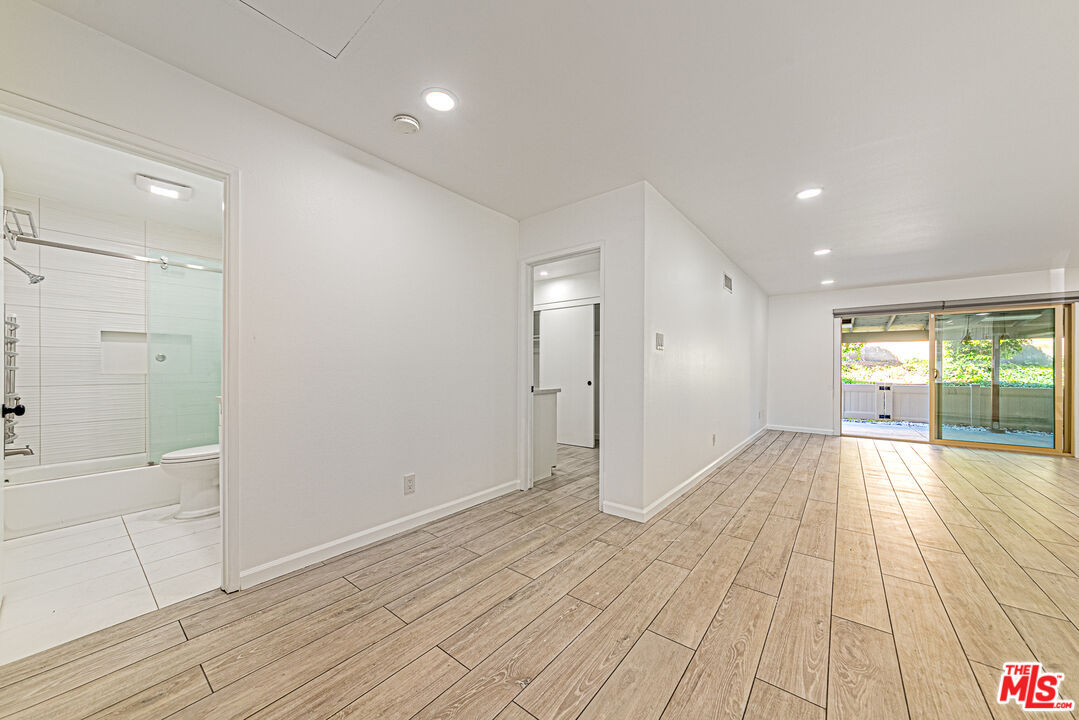 1941 Pine Drive La Habra, CA 90631 - Photo 13 of 35 a view of empty room with wooden floor and fan