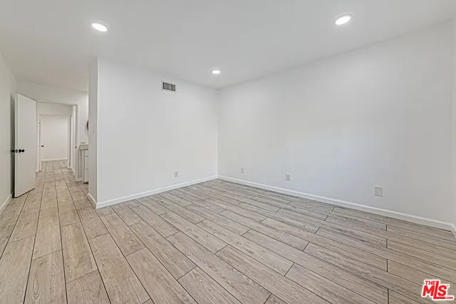 a bathroom with a double vanity sink and a mirror with shower