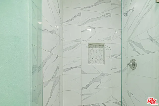 a view of hallway with wooden floor