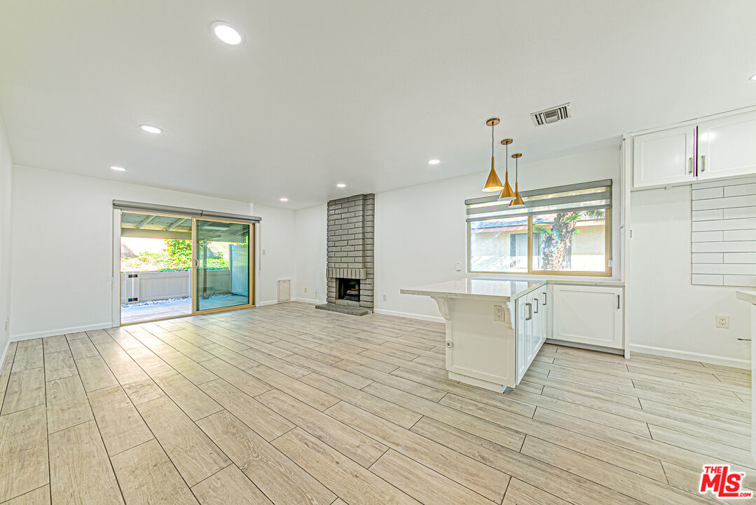 1941 Pine Drive La Habra, CA 90631 - Photo 5 of 35 a view of an empty room with wooden floor and a window