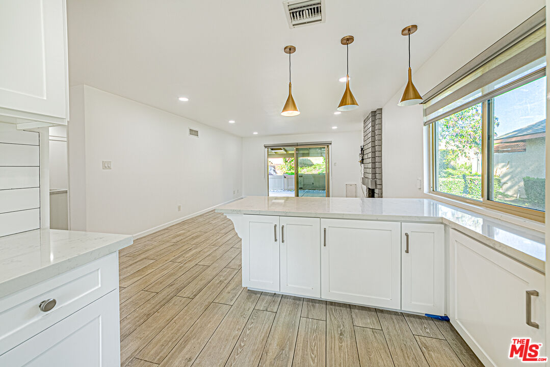 1941 Pine Drive La Habra, CA 90631 - Photo 9 of 35 a view of a kitchen with wooden floor and windows
