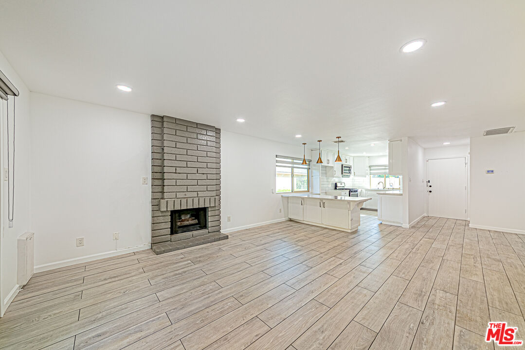 1941 Pine Drive La Habra, CA 90631 - Photo 10 of 35 a view of kitchen with livingroom and fireplace