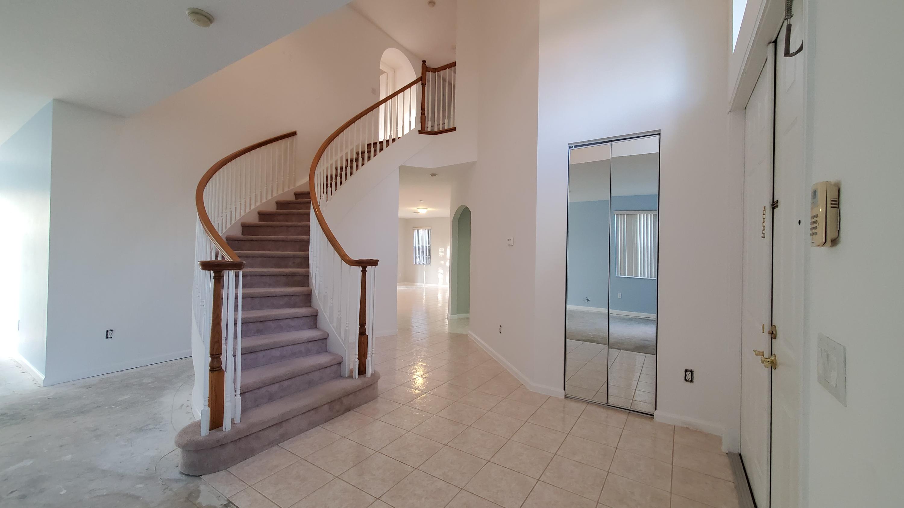 2252 Ridgewood Circle Royal Palm Beach, FL 33411 - Photo 11 of 40 a view of entryway with hallway and stairs