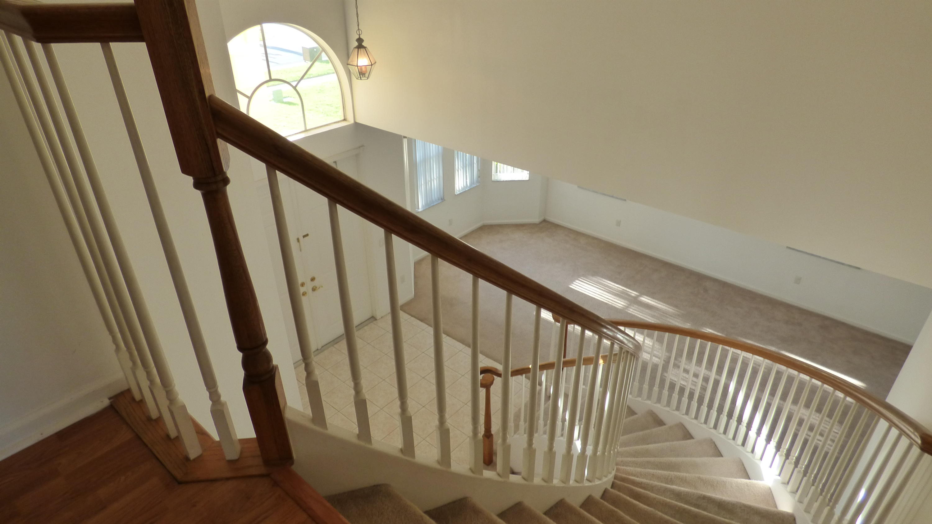 2252 Ridgewood Circle Royal Palm Beach, FL 33411 - Photo 12 of 40 a view of staircase with railing and white walls