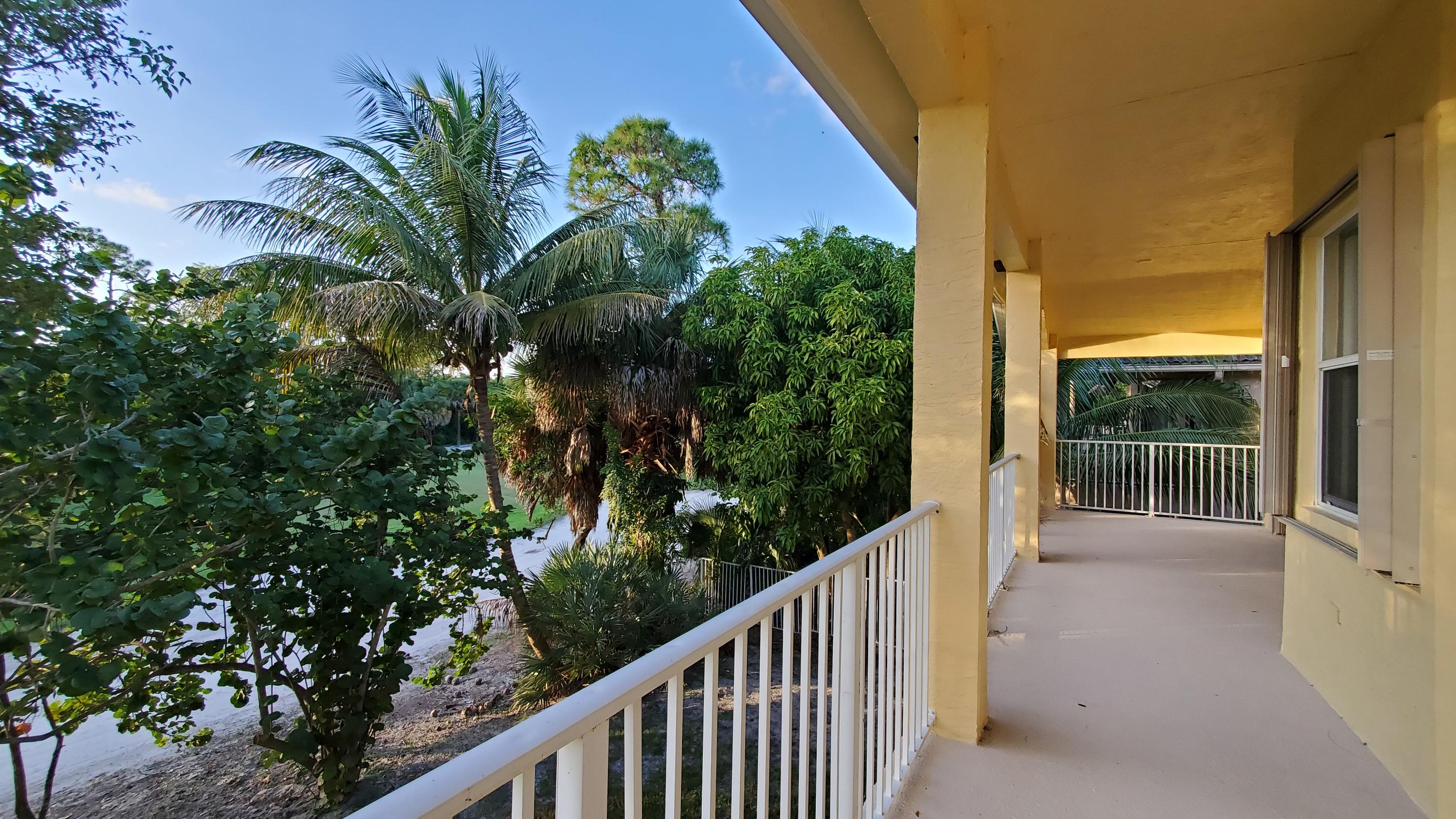 2252 Ridgewood Circle Royal Palm Beach, FL 33411 - Photo 22 of 40 a view of balcony and yard