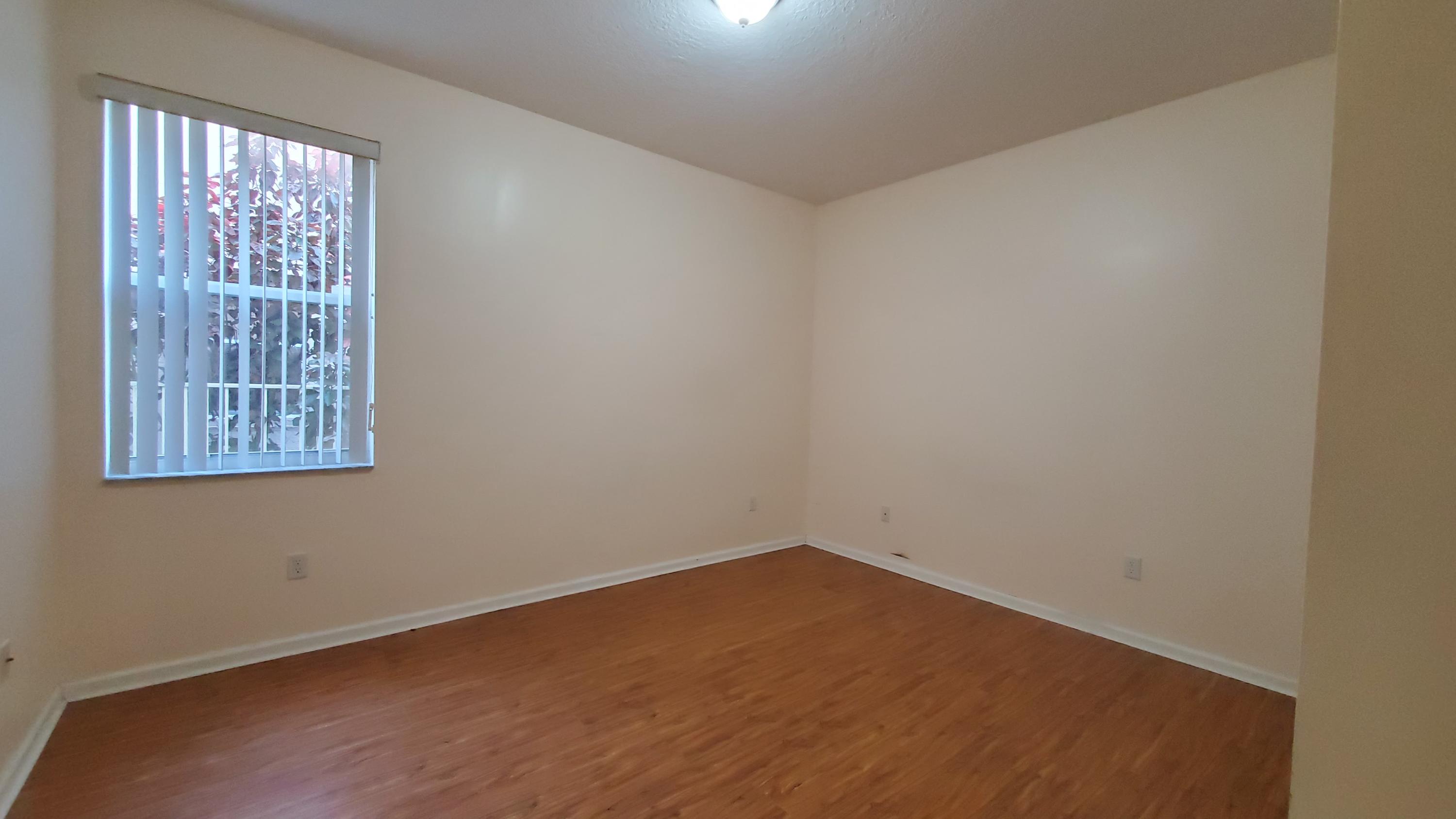 2252 Ridgewood Circle Royal Palm Beach, FL 33411 - Photo 31 of 40 an empty room with a window