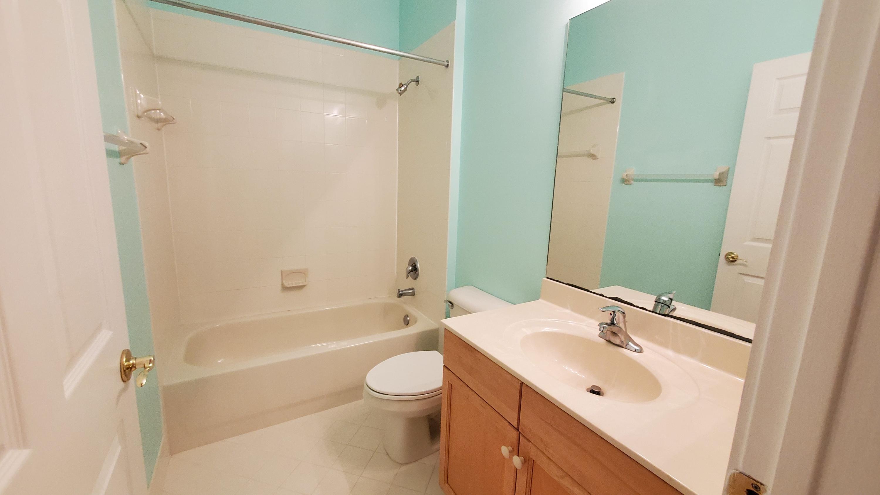 2252 Ridgewood Circle Royal Palm Beach, FL 33411 - Photo 32 of 40 a bathroom with a sink toilet and shower