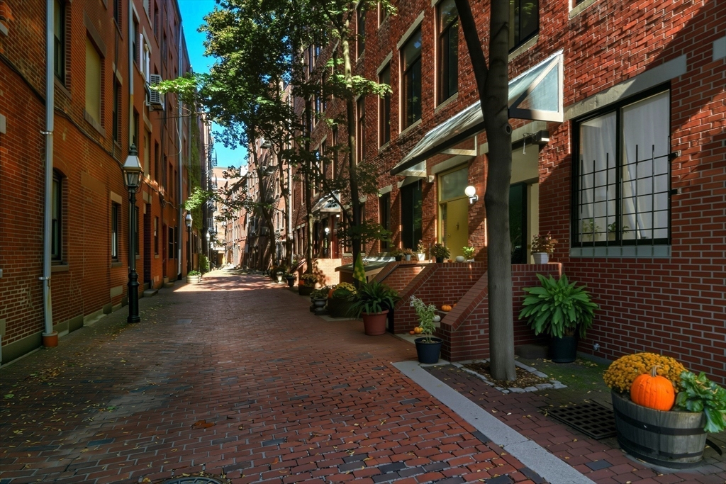 130 Fulton Street, Unit 7 Boston, MA 02109 - Photo 22 of 24 a view of a street with cars parked