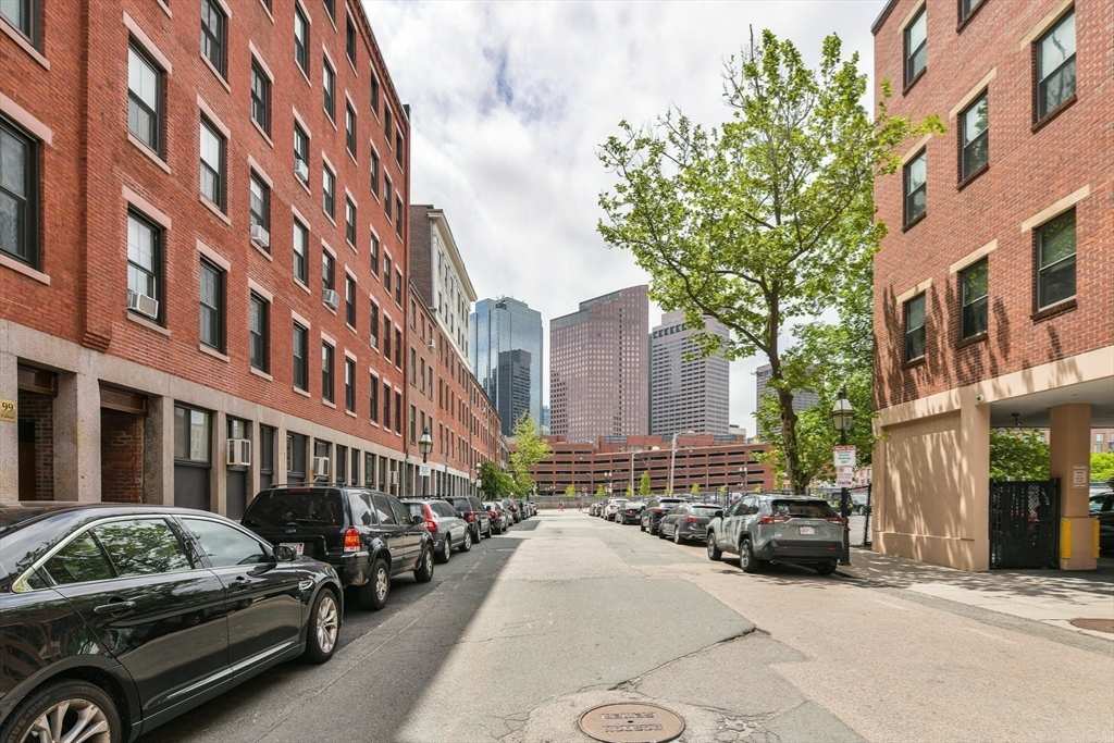 130 Fulton Street, Unit 7 Boston, MA 02109 - Photo 24 of 24 a city street lined with buildings and cars