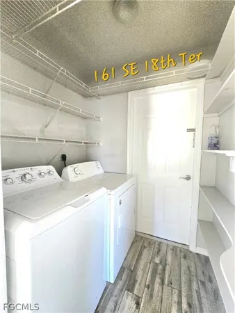 a utility room with dryer and washer