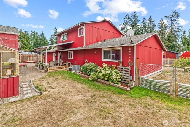a view of a house with wooden fence