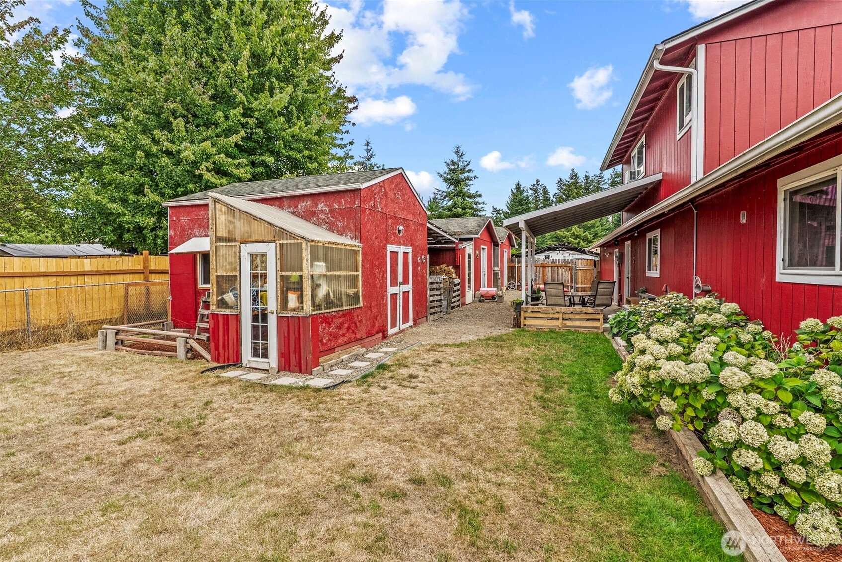 114 Mason Road Silverlake, WA 98645 - Photo 21 of 29 a view of a house with a yard patio and deck