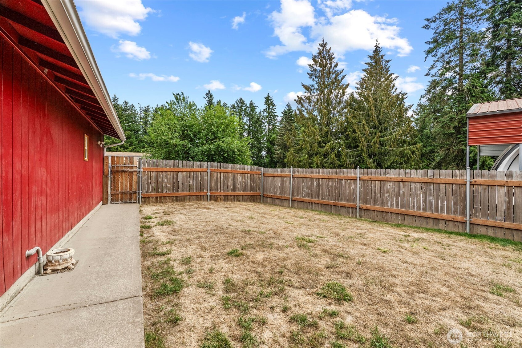 114 Mason Road Silverlake, WA 98645 - Photo 24 of 29 a view of backyard with green space and wooden fence