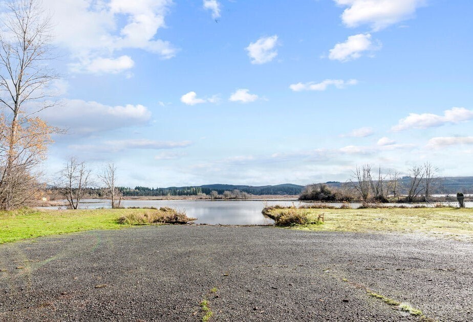 114 Mason Road Silverlake, WA 98645 - Photo 28 of 29 a view of a lake with houses in the back