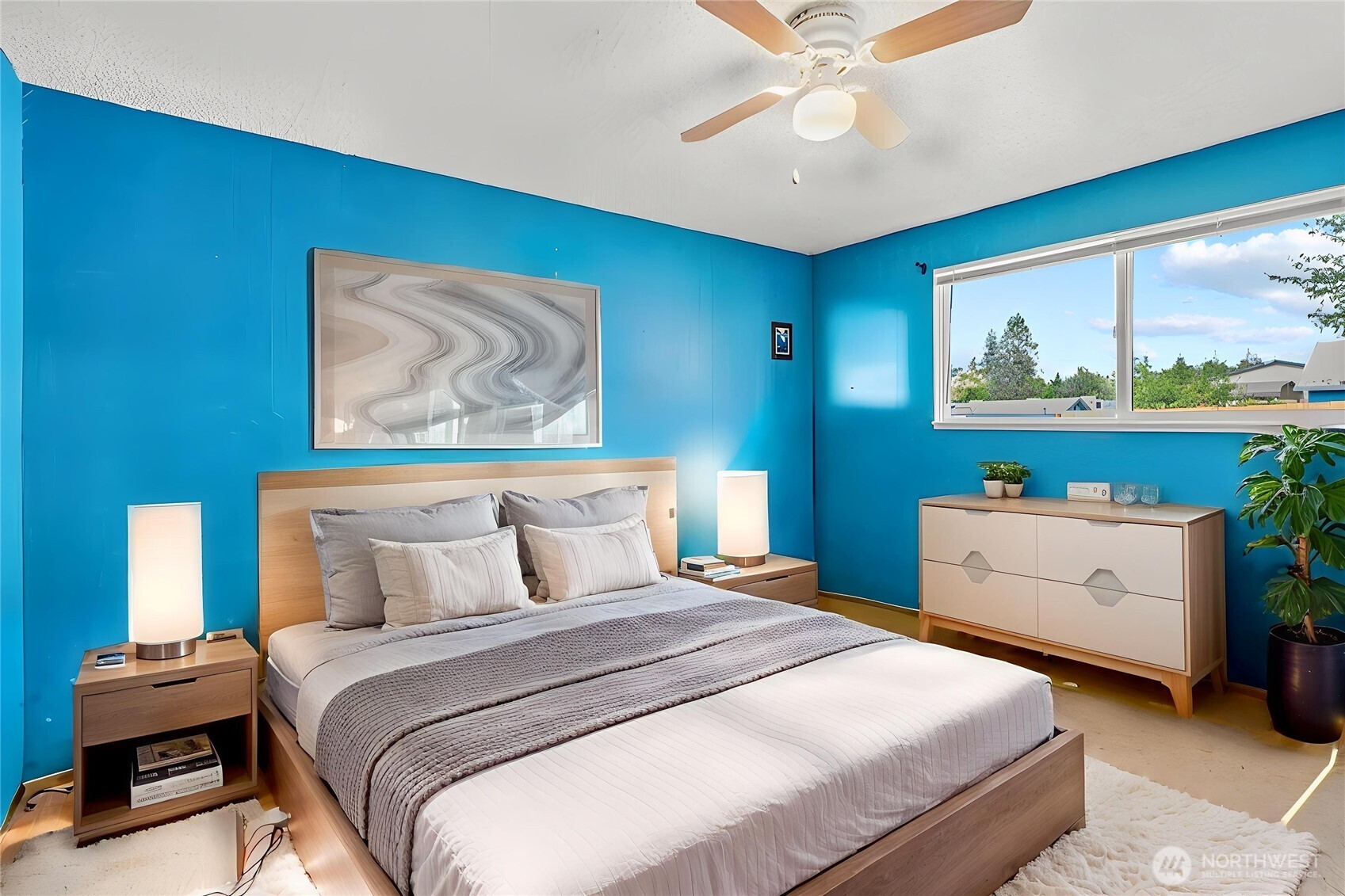 114 Mason Road Silverlake, WA 98645 - Photo 9 of 29 a bedroom with a bed and a wall painting