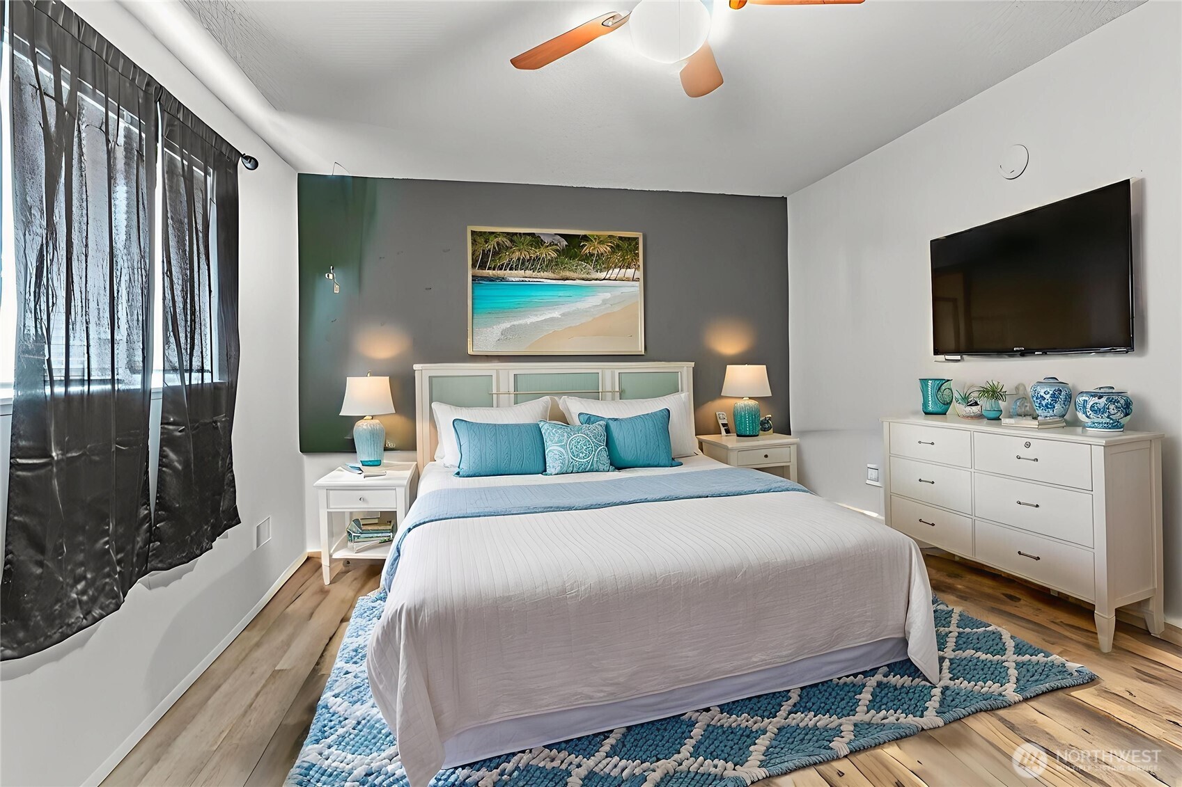 114 Mason Road Silverlake, WA 98645 - Photo 10 of 29 a bedroom with a large bed and a flat screen tv