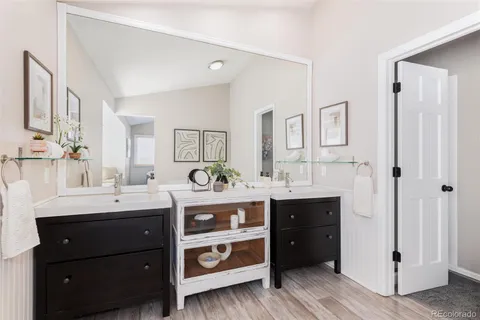 a white bath tub sitting next to a white sink