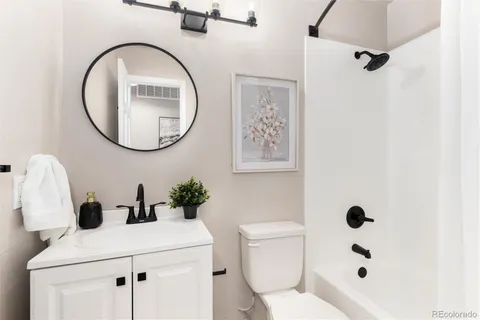 a view of a livingroom with furniture and a potted plant