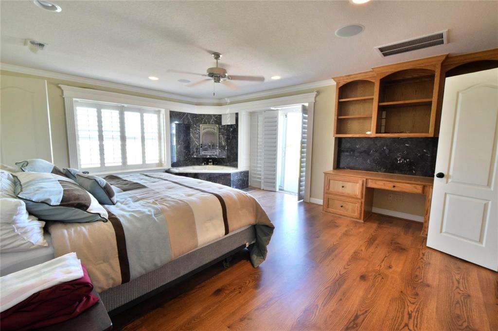 108 Barham Lane Bridgeport, TX 76426 - Photo 20 of 30 a spacious bedroom with a bed and wooden floor