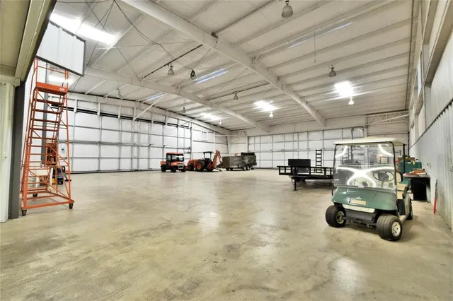 a view of parking garage with cars