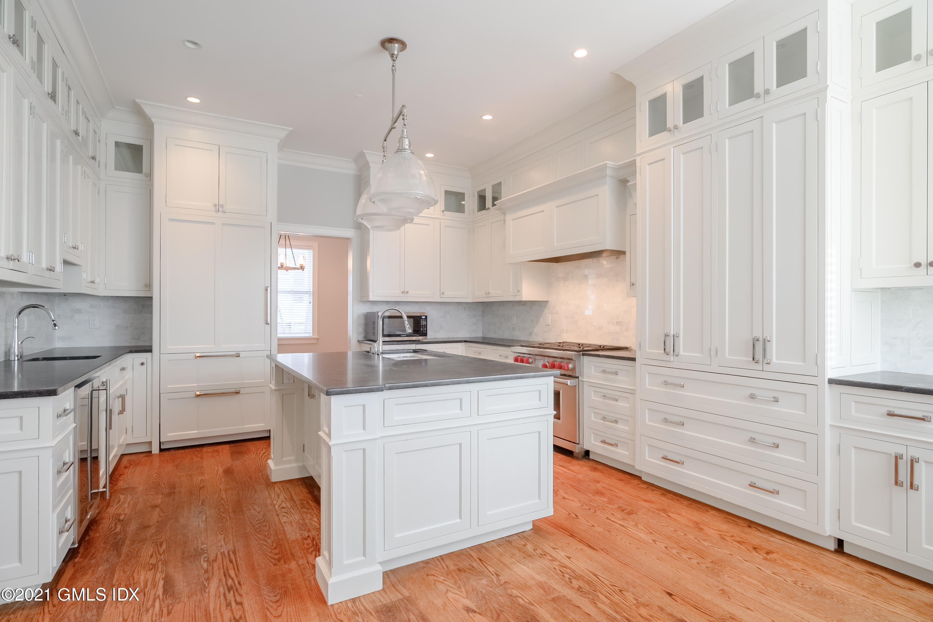 623 Steamboat Road, Unit A Greenwich, CT 06830 - Photo 14 of 43 a kitchen with stainless steel appliances granite countertop a sink a stove and a refrigerator