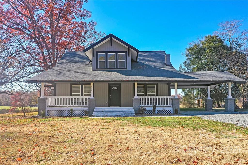 313 Old Williams Road Wingate, NC 28174 - Photo 1 of 46 front view of a house with a yard