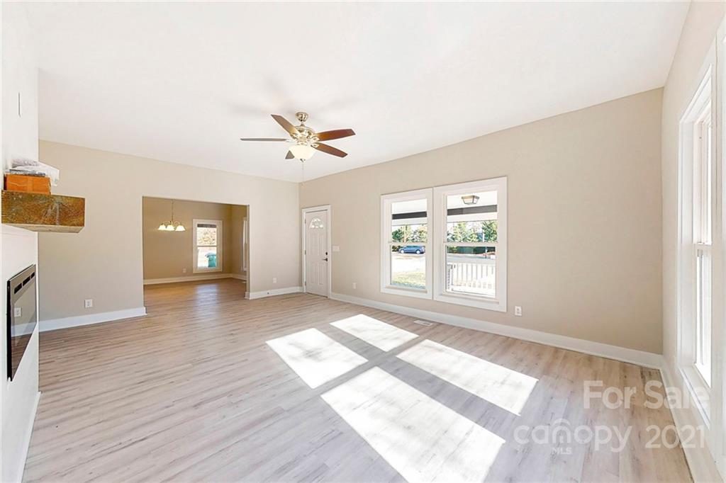 313 Old Williams Road Wingate, NC 28174 - Photo 16 of 46 a view of an empty room with a window and wooden floor