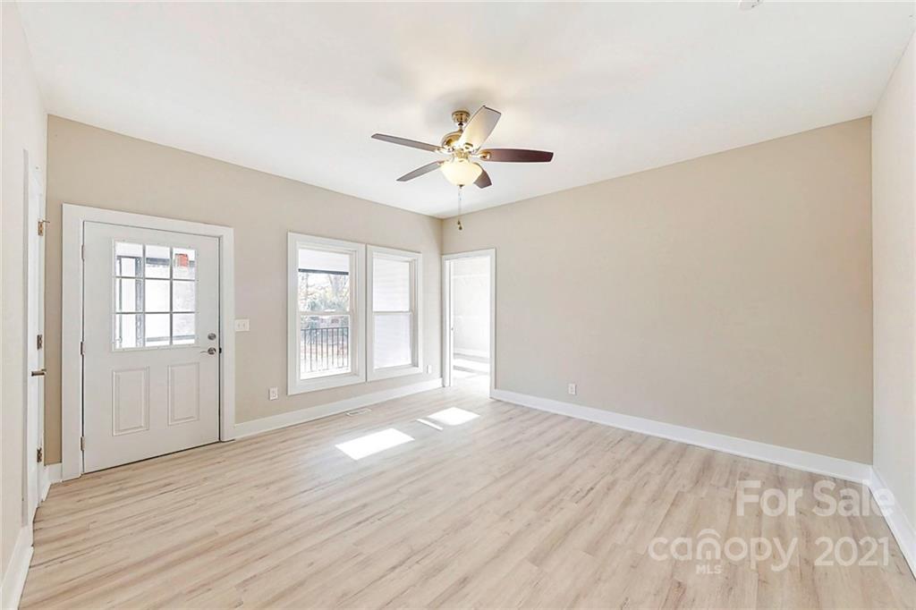 313 Old Williams Road Wingate, NC 28174 - Photo 18 of 46 wooden floor in an empty room with a window