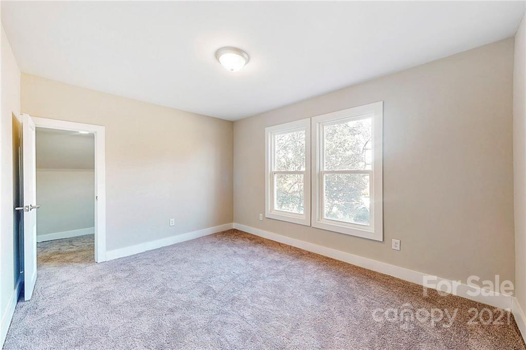 313 Old Williams Road Wingate, NC 28174 - Photo 27 of 46 an empty room with windows