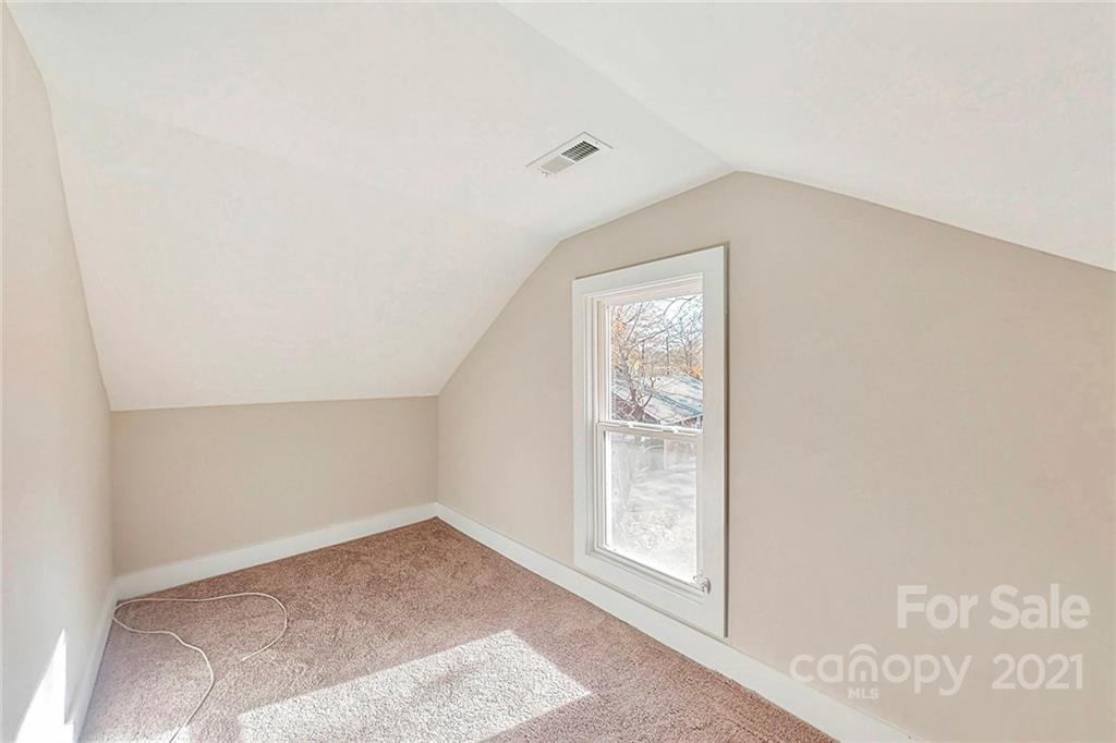 313 Old Williams Road Wingate, NC 28174 - Photo 29 of 46 an empty room with windows