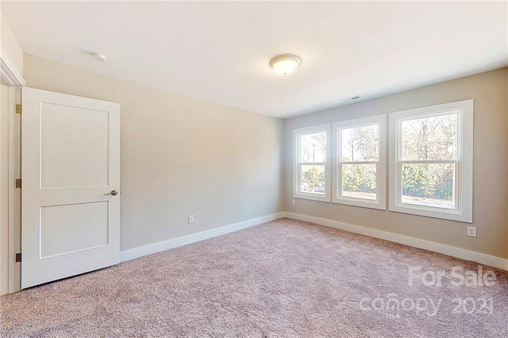 313 Old Williams Road Wingate, NC 28174 - Photo 32 of 46 an empty room with windows