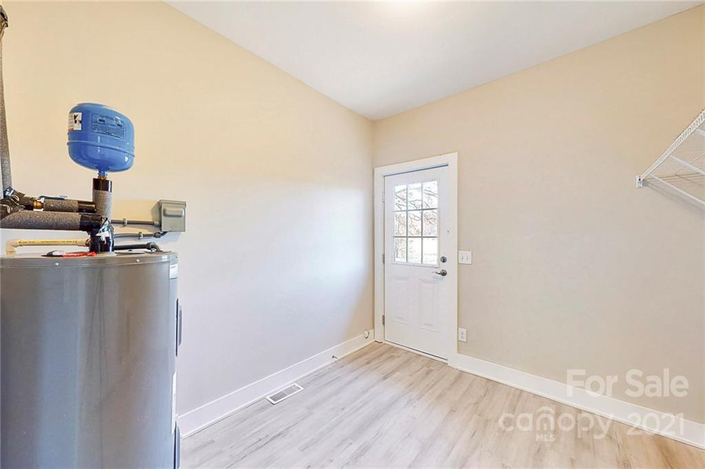 313 Old Williams Road Wingate, NC 28174 - Photo 37 of 46 a view of a livingroom with wooden floor and a window