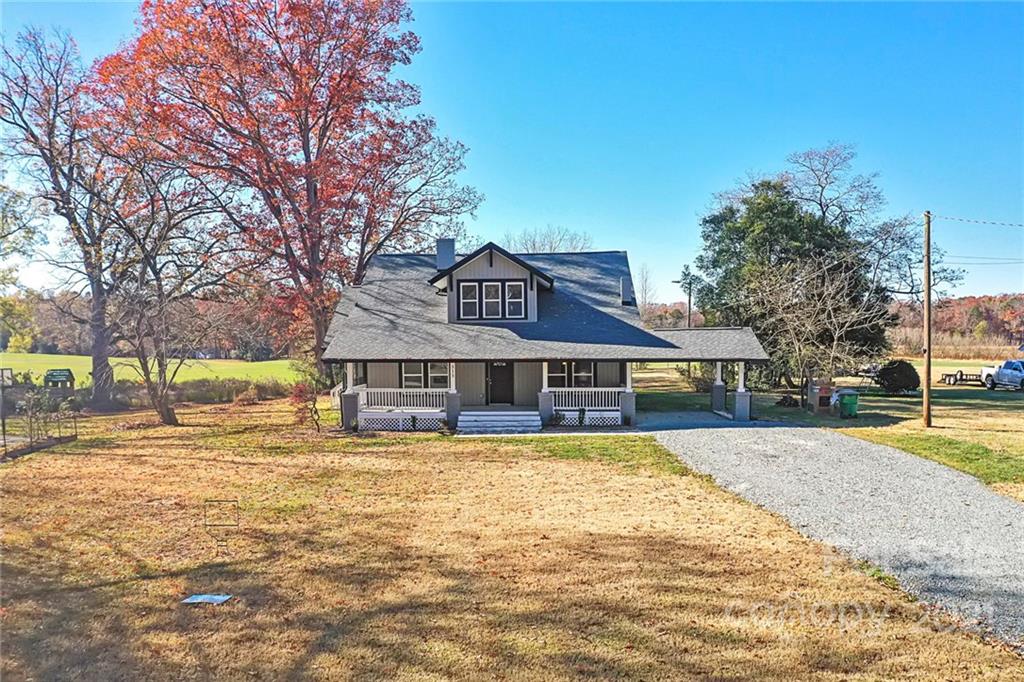 313 Old Williams Road Wingate, NC 28174 - Photo 39 of 46 a view of a house with a yard covered with trees