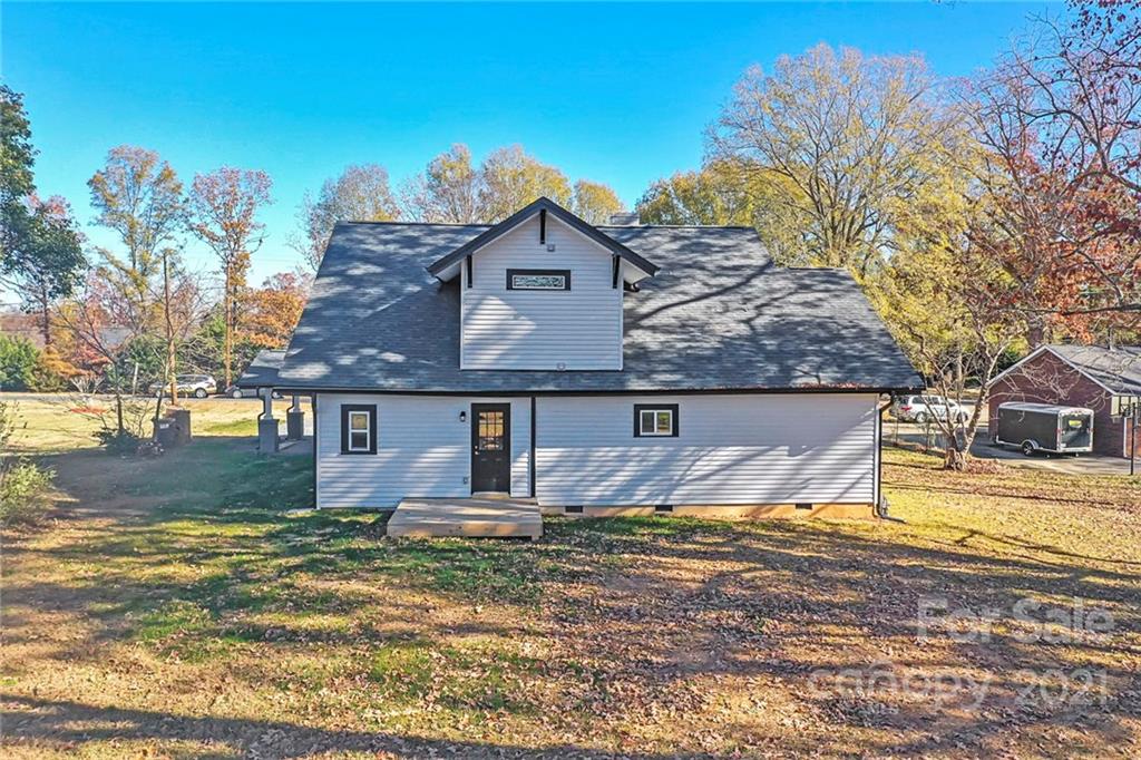 313 Old Williams Road Wingate, NC 28174 - Photo 4 of 46 a front view of a house with a yard
