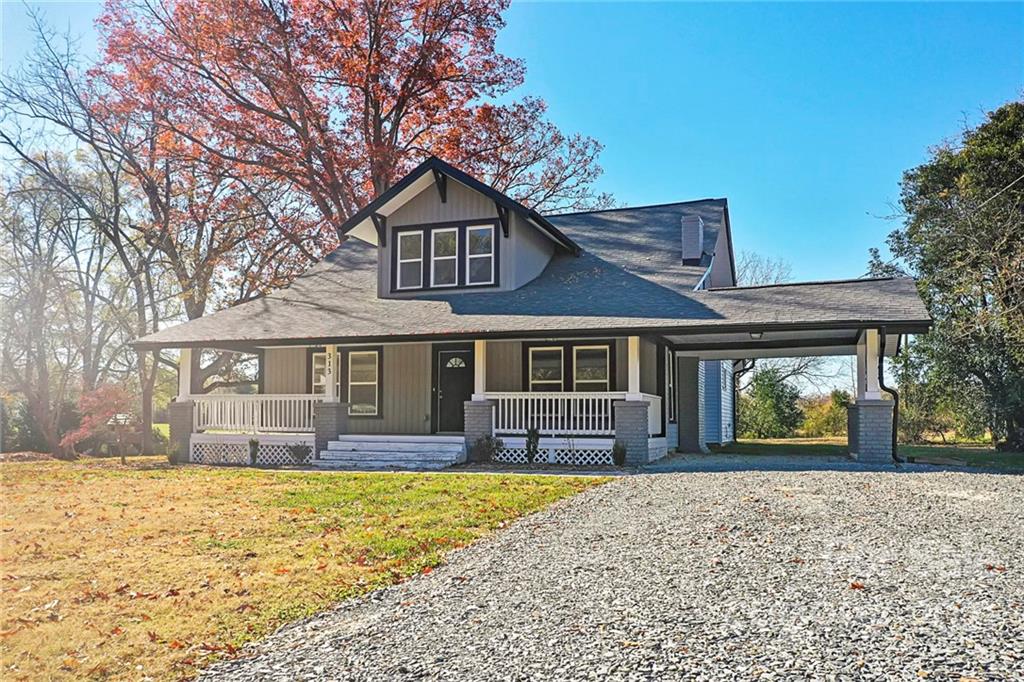313 Old Williams Road Wingate, NC 28174 - Photo 43 of 46 a front view of a house with a yard