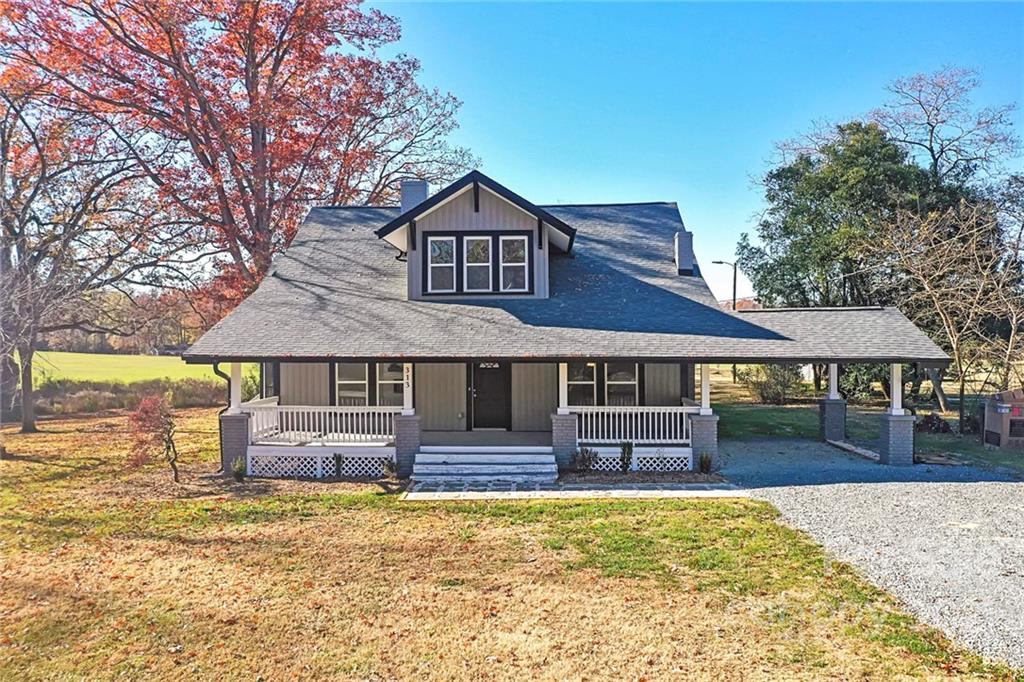 313 Old Williams Road Wingate, NC 28174 - Photo 45 of 46 a front view of a house with a yard