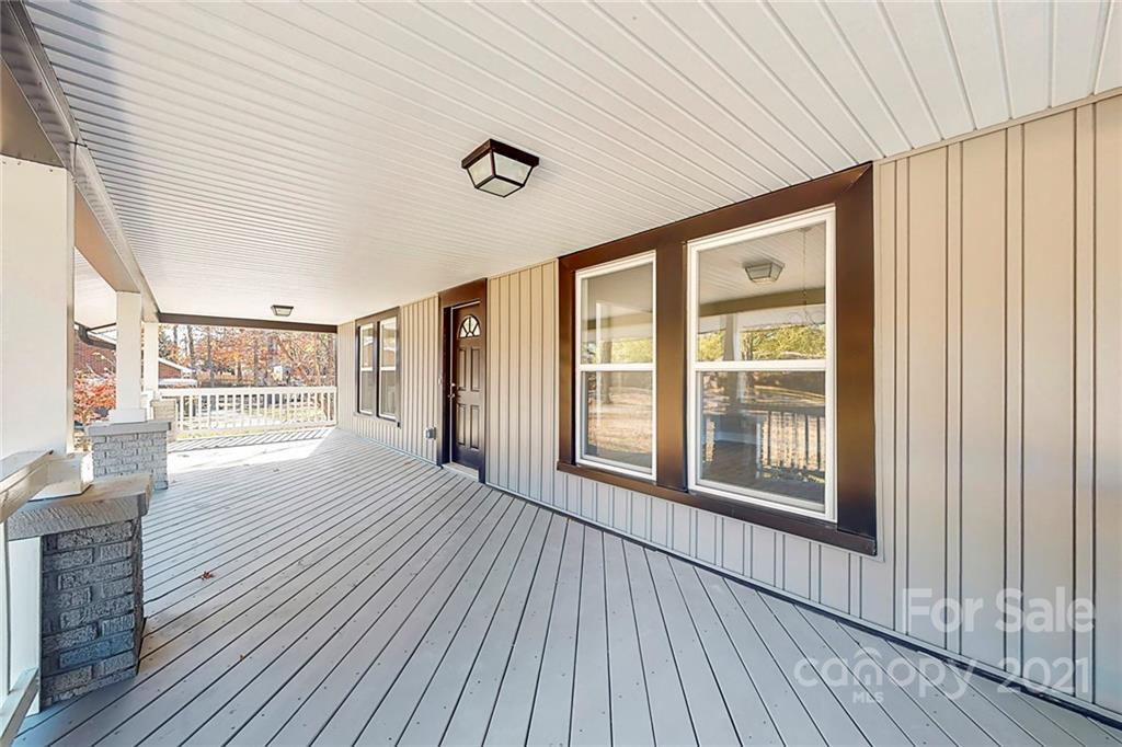 313 Old Williams Road Wingate, NC 28174 - Photo 6 of 46 a view of an empty room with wooden floor and a window