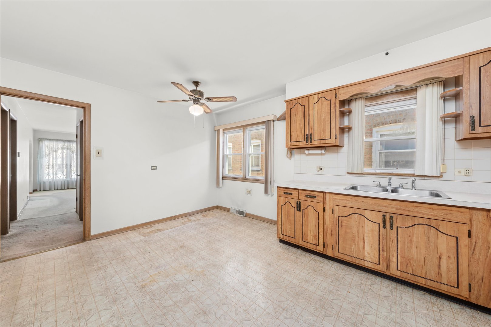 6511 West 63rd Place Chicago, IL 60638 - Photo 3 of 12 a bathroom with a granite countertop sink mirror and